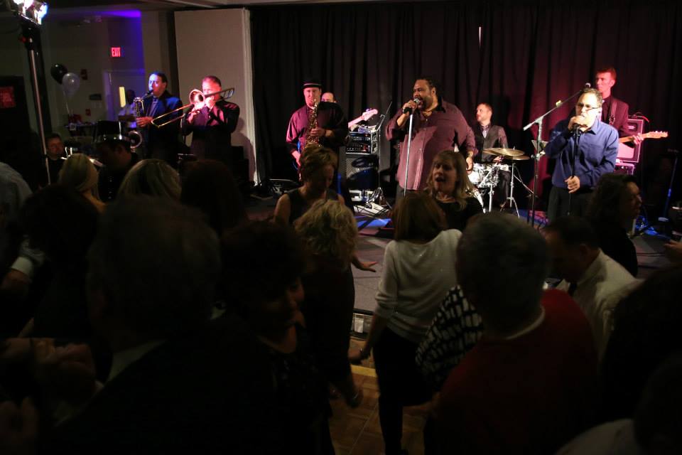 A live band performing a soulful set on stage.